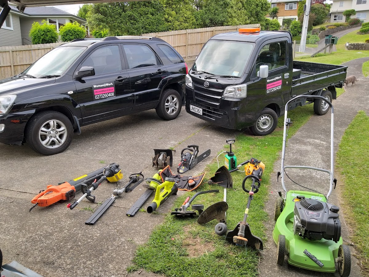 The two sign-written Woman@work vehicles with the full set of gardening tools laid out
